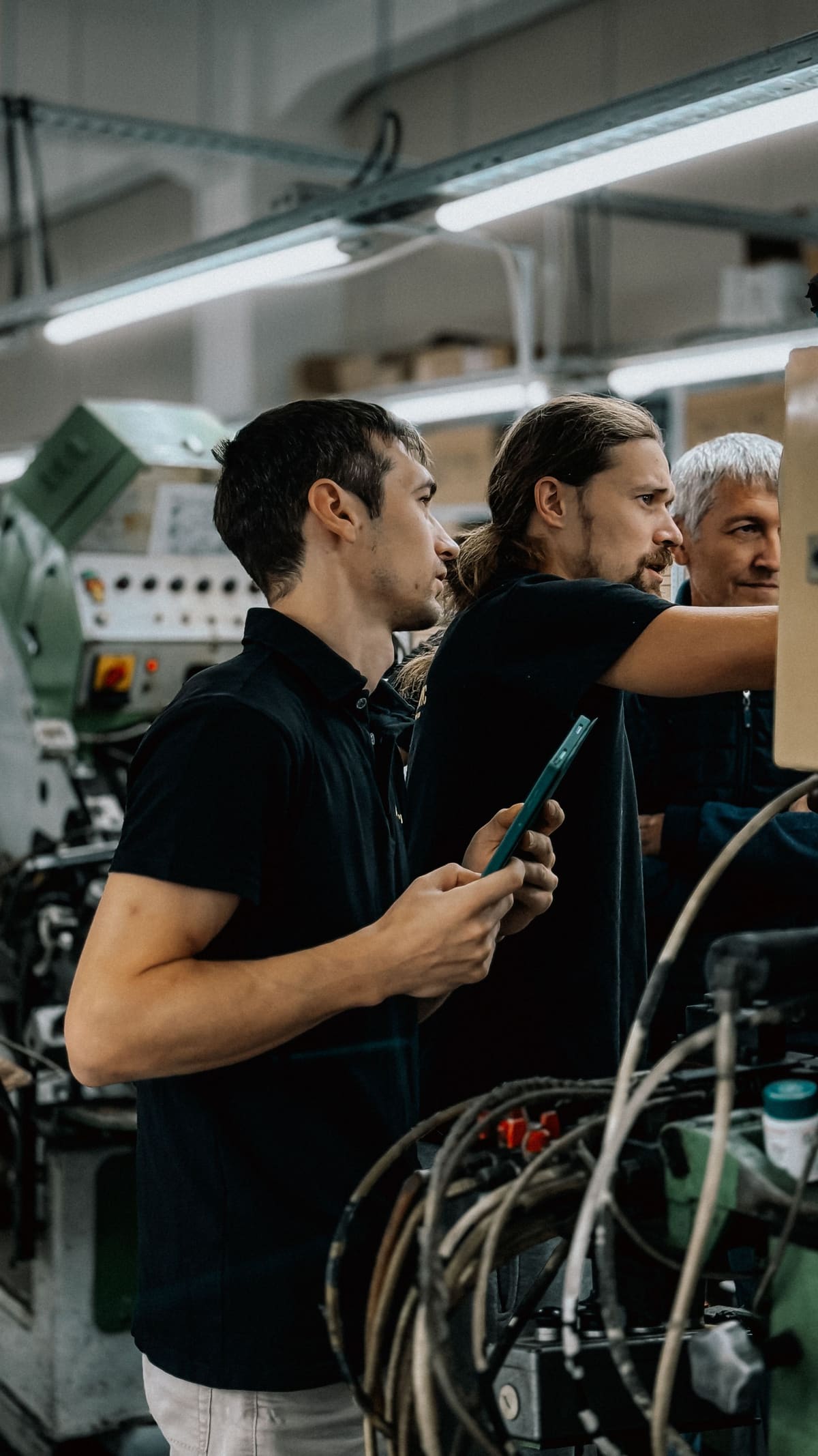 An engineering team reviewing equipment on the shop floor
