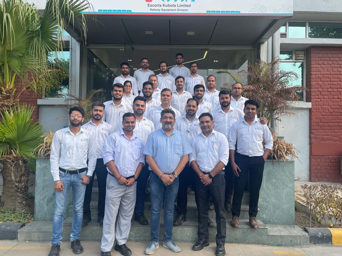 A corporate training cohort posing together after completing their Six Sigma program